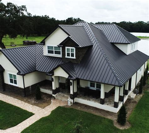 brick house with black metal roof|brick and shingle combinations.